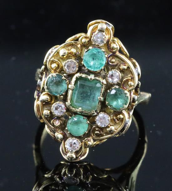 A Victorian gold, five stone emerald and six stone diamond set cluster dress ring, size L/M.